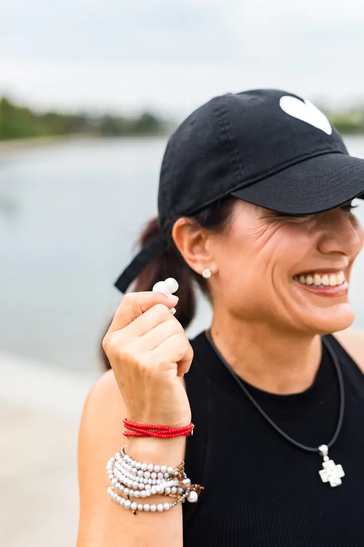 Julie Kaminski, Charleston health coach, walking outdoors supporting women’s wellness and midlife health