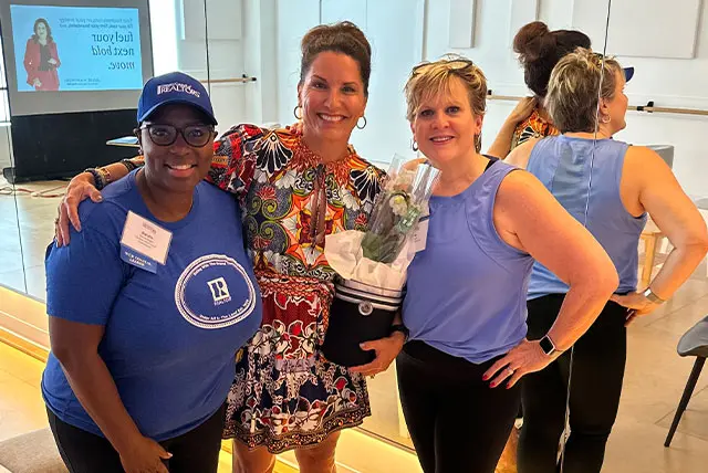 Julie Kaminski working as a women’s health coach guiding clients through personalized wellness coaching